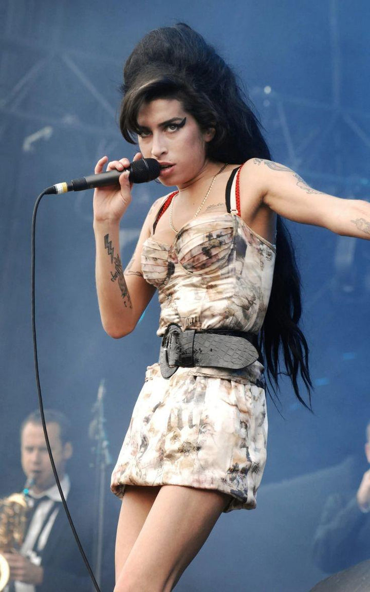 Galliano silk corset dress.
Early 2000s archive – same model worn on stage by Amy Winehouse (museum-documented)