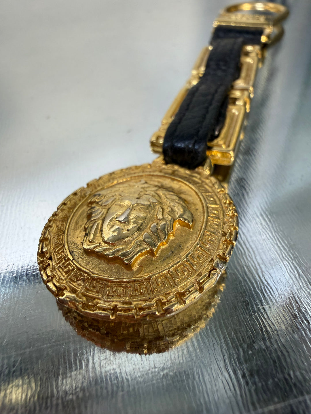 Gianni Versace gold Medusa keychain with leather chain