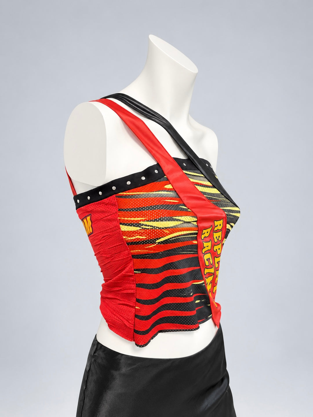Replay racing asymmetric top