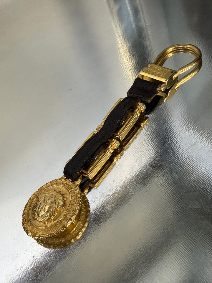 Gianni Versace gold Medusa keychain with leather chain