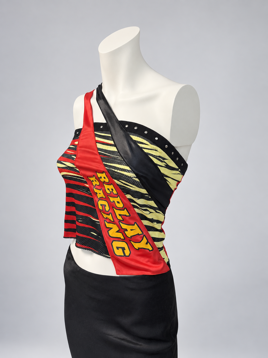 Replay racing asymmetric top